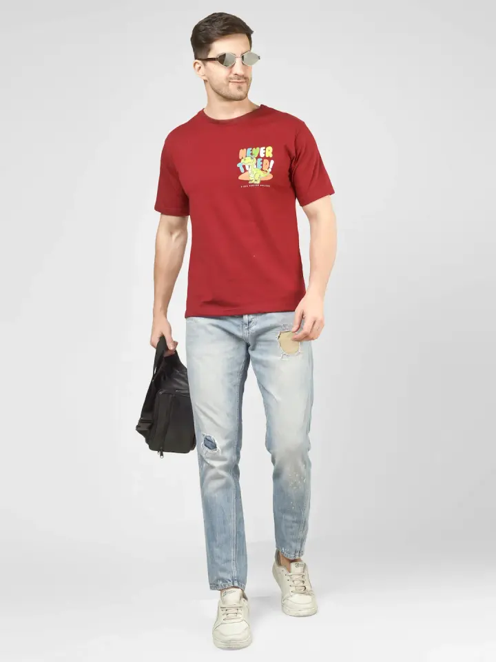 Never Tired Dino Printed T-Shirt in Maroon, shown on model